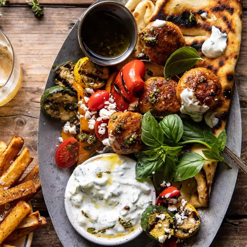 Spicy Oregano Meatballs with Grilled Vegetables and Tzatziki