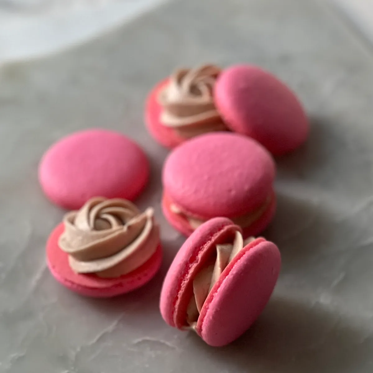Macaron filled with raspberry German buttercream