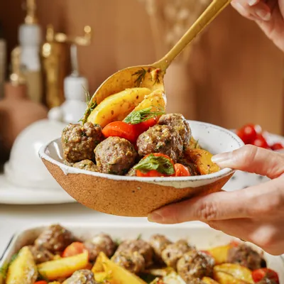 Recipe 'Sheet Pan Baked Greek Meatballs &amp; Lemon Potatoes'