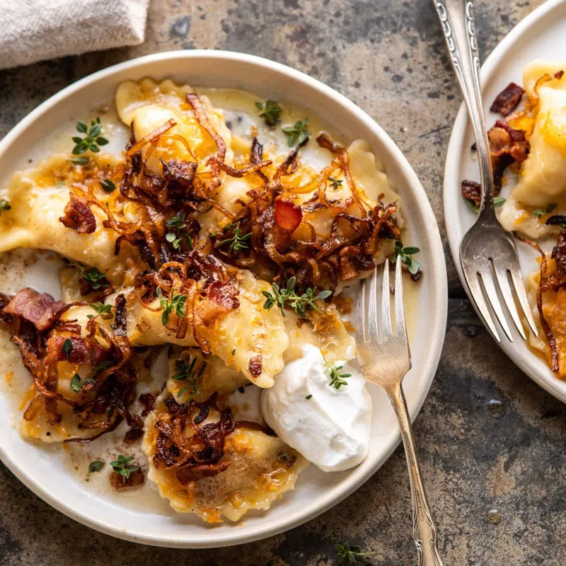 Cheddar Pierogies with Caramelized Onions and Bacon