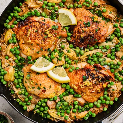 Recipe 'One Pan Lemon Chicken and Rice with Artichokes and Peas'