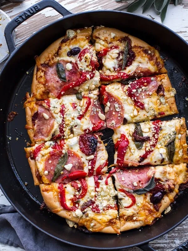 Sun-Dried Tomato and Olive Pesto Pizza with Salami + Roasted Red Peppers.