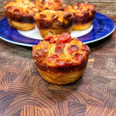 Recipe 'Delicious Muffin Tin Pizzas: Quick and Easy Recipe for Family Fun'