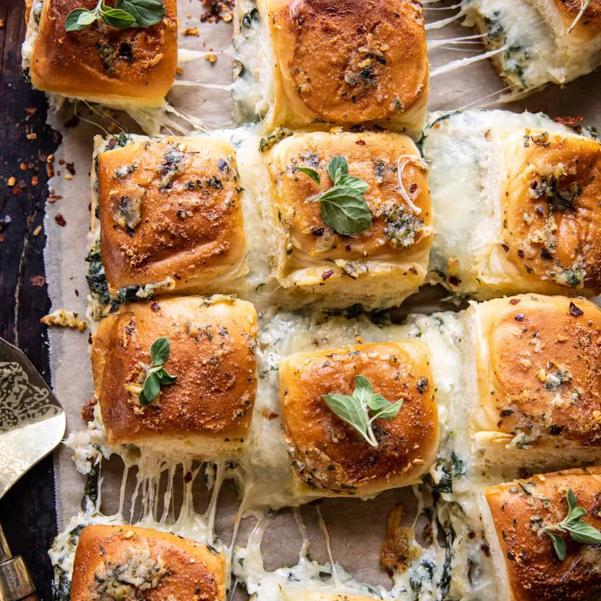 Pull Apart Roasted Garlic Spinach and Artichoke Dip Sliders