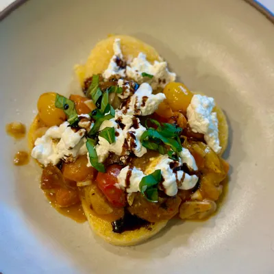 Recipe 'Crispy Polenta Cakes with Burst Tomatoes and Burrata'