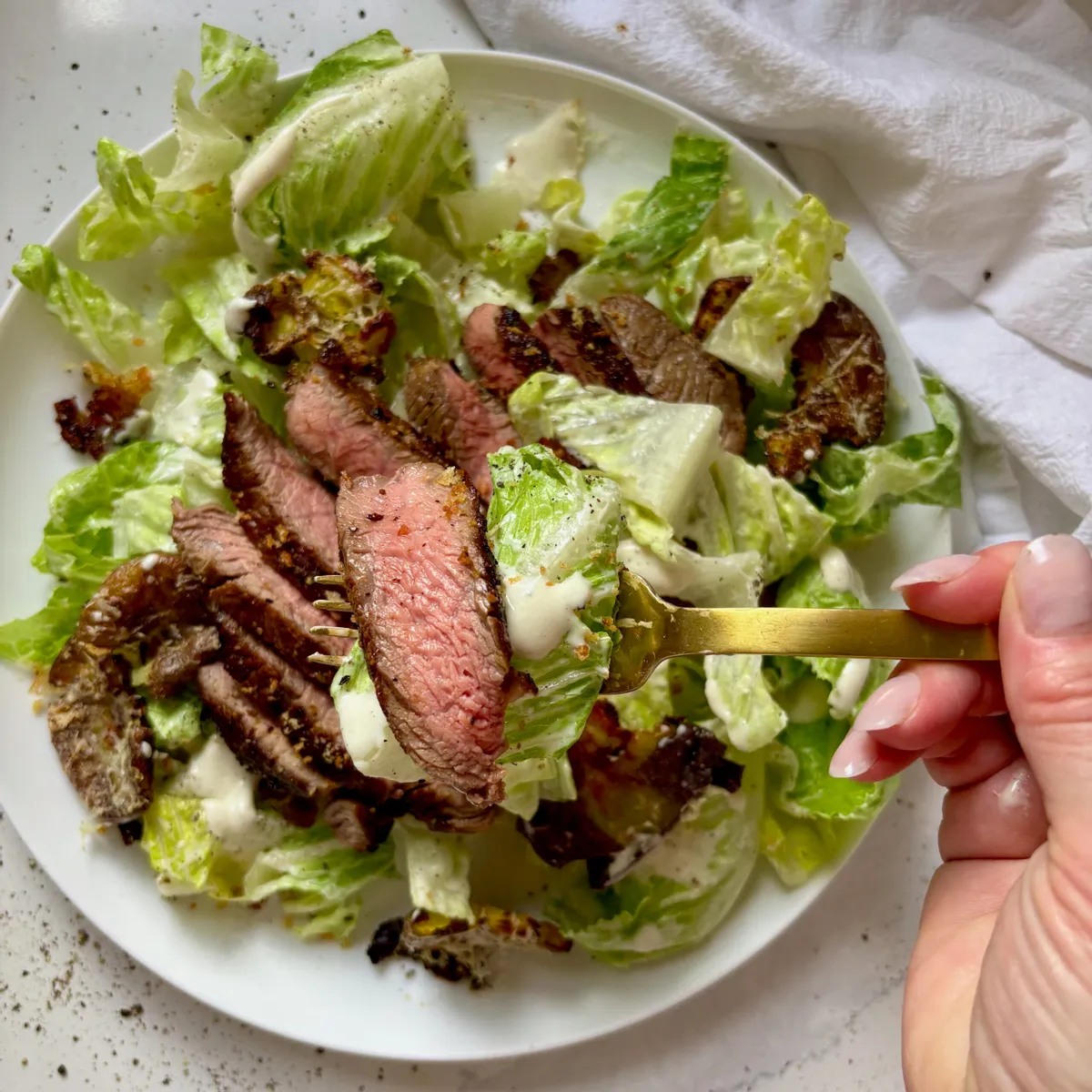 Caesar Salad with Steak and Garlic Parmesan Smashed Potato Croutons