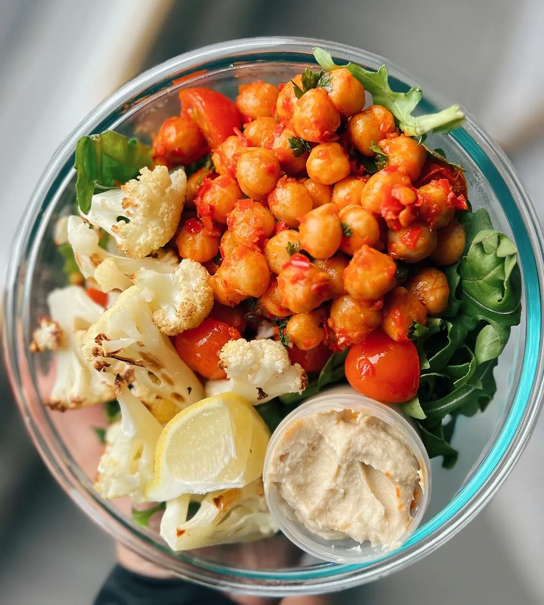 Harissa Spiced Chickpeas, Arugula, & Roasted Cauliflower Salad paired with hummus